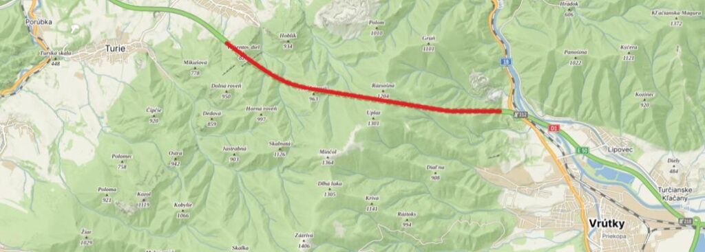Map showing a red curved road segment crossing green hills from Turie toward Vrútky in central Slovakia.