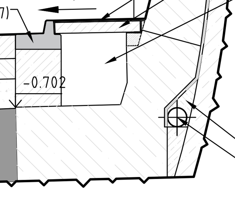 Cross-sectional view of a mechanical housing with a stepped shaft, dimension -0.702, and gear teeth along the right edge.
